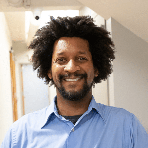 Headshot of Qawi Telesford.